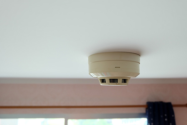 smoke detector mounted on ceiling in home six safety features for alertness