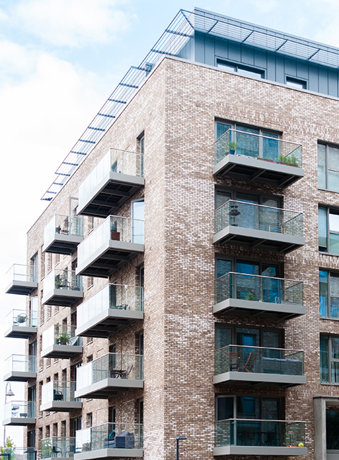 modern apartment building with multiple balconies featuring contemporary architecture and stylish design two floors and large windows